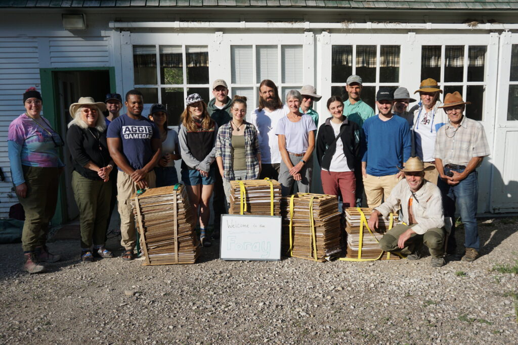 The Foray 2025 participants posing with the full plant presses